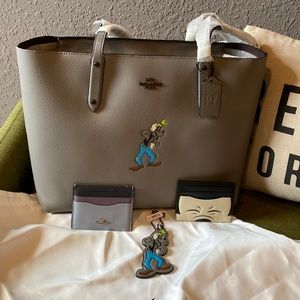 Brand new Coach X Disney Goofy central zip tote. Plus brand new extras